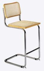 Seats and Stools' Classic Breuer Bar Stool is pictured with upholstered seat and back in oatmeal fabric and natural wood insert. 